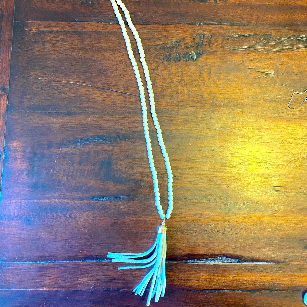 Long White bead necklace with blue tassel